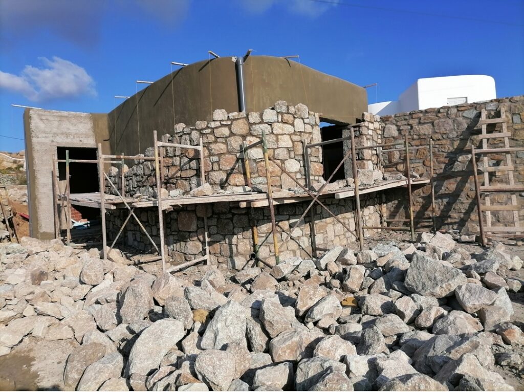 Natural stone masonry construction at a Mykonos property