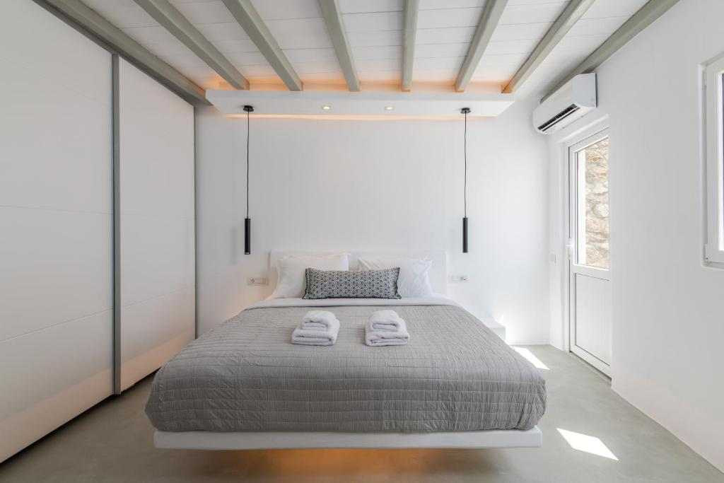 Xenia — Bedroom with exposed ceiling beams
